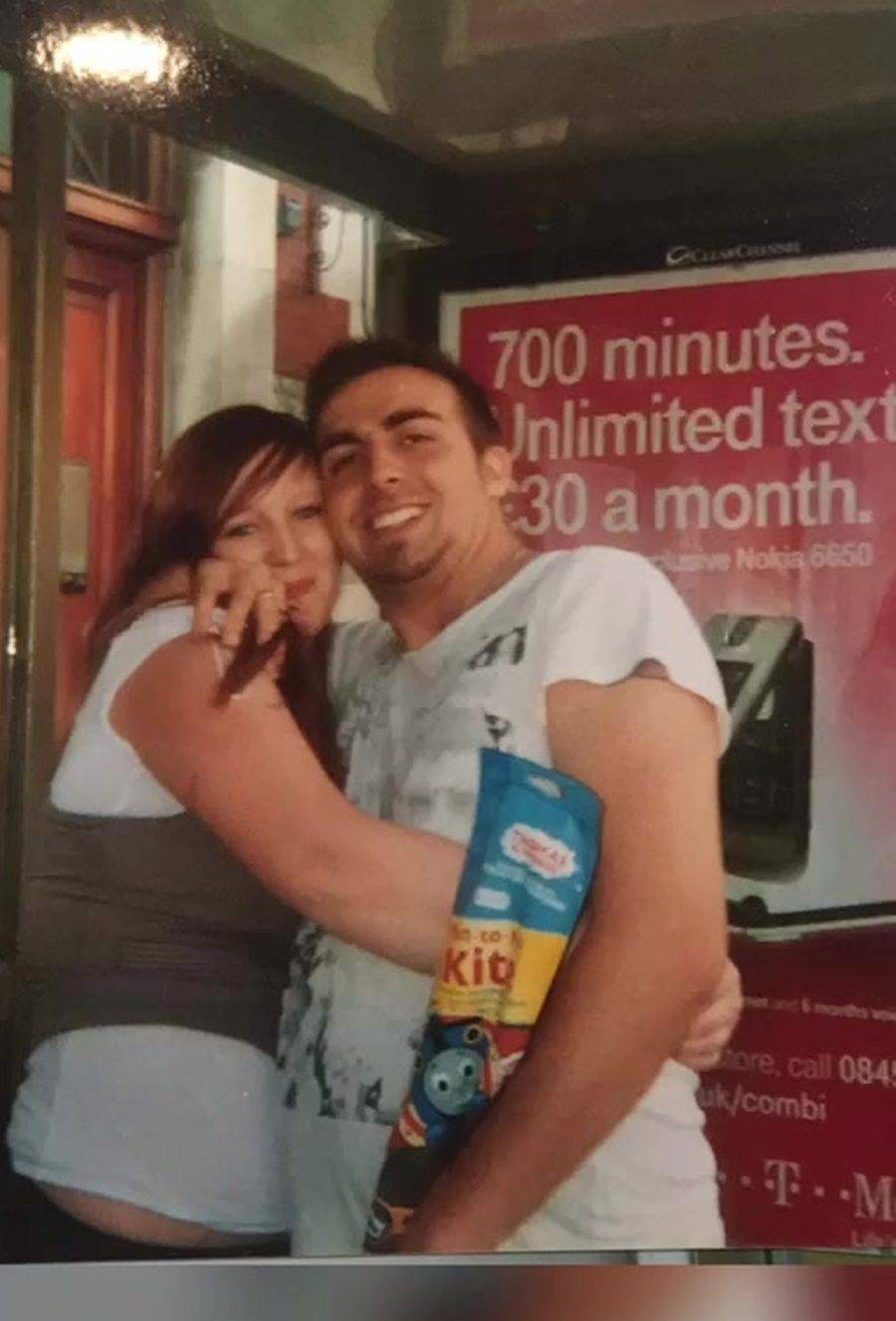 Danny hugging Becki, holding Joshua's Thomas the Tank Engine bag, 2006